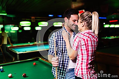 Young attractive couple on date in snooker club Stock Photo