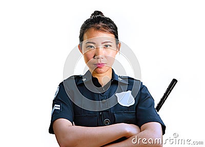 Young attractive and defiant Asian Chinese police officer in uniform holding defense stick serious isolated on white background in Stock Photo