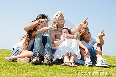 Young attractive family pointing Stock Photo