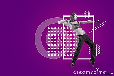 A young attractive female dancer in sleeveless crop top and sweatpants dancing on a purple background with white Stock Photo