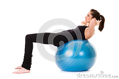 Young attractive female exercise using ball Stock Photo