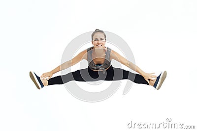 Young attractive girl dancer doing the splits Stock Photo