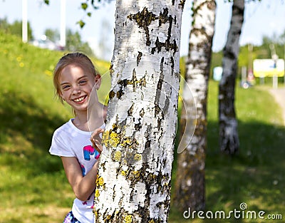Young attractive girl in the park. Stock Photo