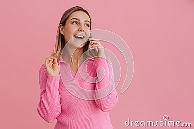 Young attractive girl plays with her hair with opened mouth Stock Photo