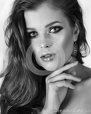 Young attractive girl with profi makeup. Monochrome shot Stock Photo