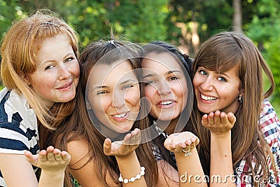 Young and attractive girlfriends have fun in park Stock Photo