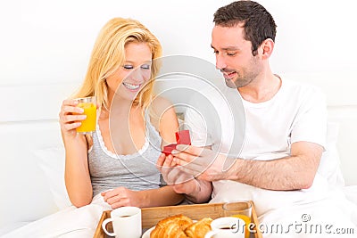 Young attractive man propose marriage to his love Stock Photo