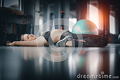 Young attractive woman fitness exercise workout in gym. Woman st Stock Photo