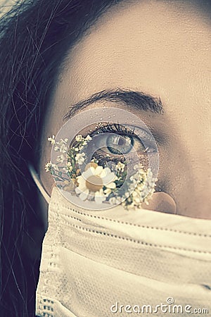 Young attractive woman in floral face mask Stock Photo