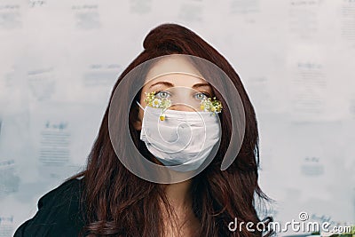 Young attractive woman in floral face mask Stock Photo