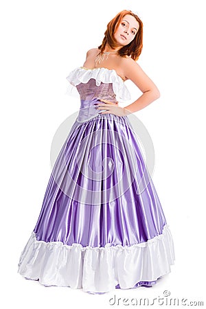 Young attractive woman in long lilac-coloured ball dress Stock Photo