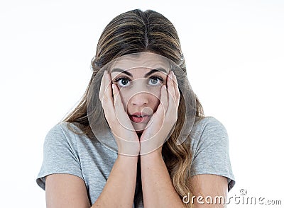 Young attractive woman looking scared, frightened and shocked. Human expressions and emotions Stock Photo