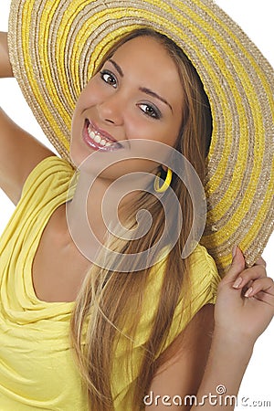 Young attractive woman with yellow shirt and strawhat Stock Photo