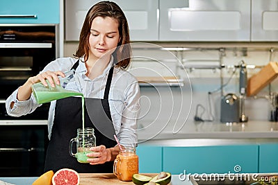 Young awesome woman pouring cocktail herself Stock Photo