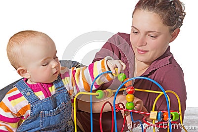 Young baby learning muscle coordination Stock Photo