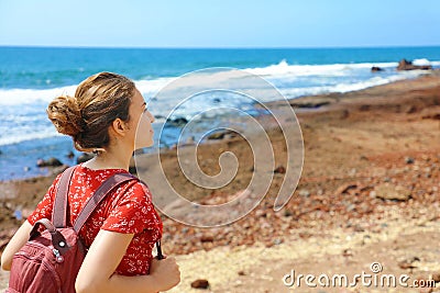 Young backpacker exploring Tenerife Island in her travel vacation on Canary Islands. Copy space Stock Photo