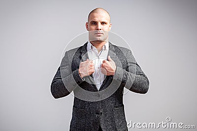 A young bald man in suit Stock Photo