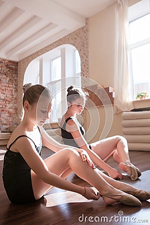 Young ballerinas. Pensive ladies in class Stock Photo