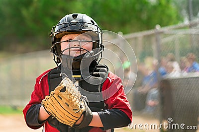 Young baseball player wearing catcher gear Stock Photo