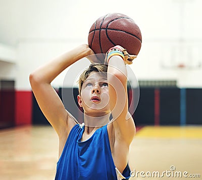 Young basketball player practicing shoot Stock Photo