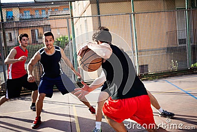 Young basketball players playing with energy Stock Photo