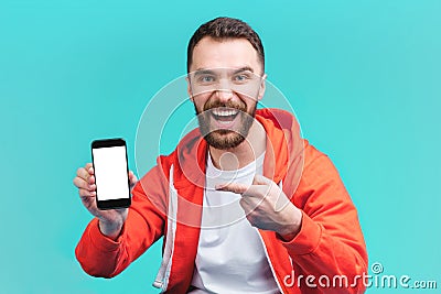 Young bearded man betting online at bookmaker`s website Stock Photo
