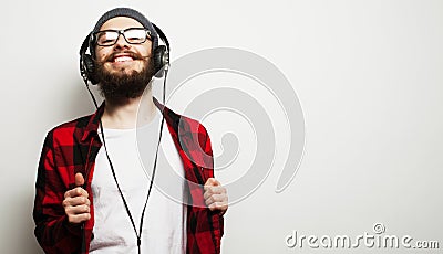 young bearded man listening to music Stock Photo