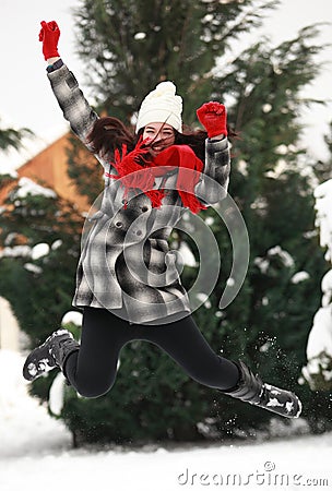 Young beauitiful woman outdoor in winter jumping Stock Photo
