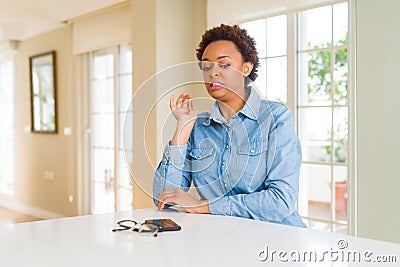 Young beautiful african american woman disgusted expression, displeased and fearful doing disgust face because aversion reaction Stock Photo