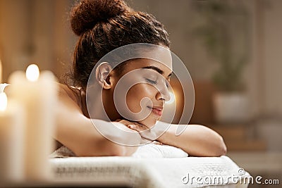 Beautiful african girl resting relaxing in spa resort with closed eyes. Stock Photo