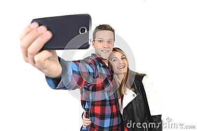 Young beautiful American couple in love taking romantic self portrait selfie photo together with mobile phone Stock Photo