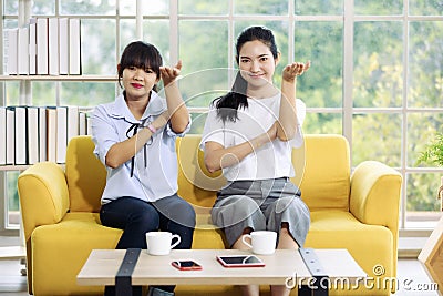 Young and beautiful Asain women sitting and demonstrat and communicate with hand sign, deaf language Stock Photo