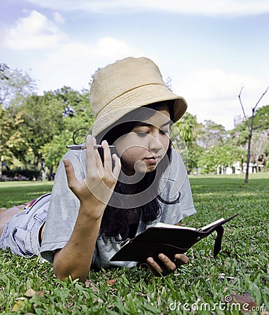 Young beautiful asian woman with book Editorial Stock Photo