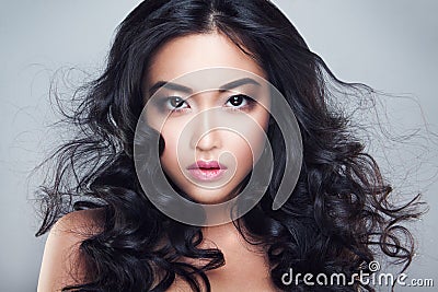 Young and beautiful asian woman with curly hair Stock Photo