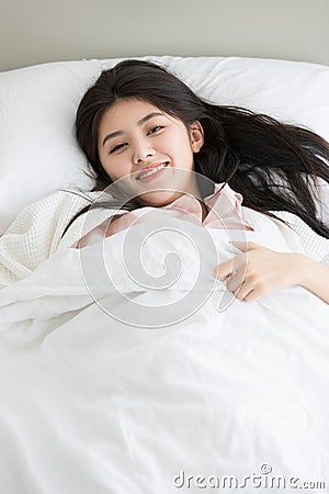 Woman in bedroom Stock Photo