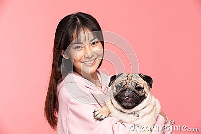 Young Beautiful Asian woman smile with clean and fresh skin Happiness and cheerful hold cute dog breed pug Stock Photo