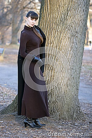 Young beautiful attractive woman in dress standing Stock Photo