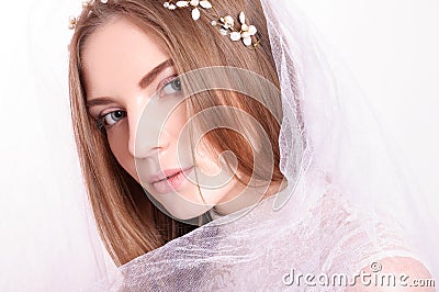 Young beautiful blond fiancee portrait with white veil. Stock Photo