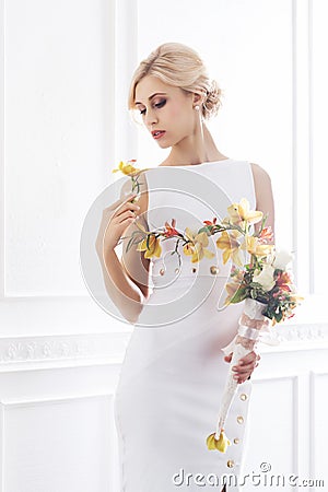 Young and beautiful bride in white dress Stock Photo