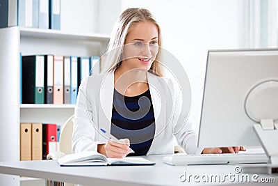 Young beautiful business woman with computer Stock Photo
