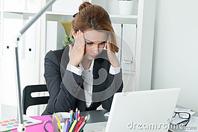 Young beautiful business woman trying to concentrate Stock Photo