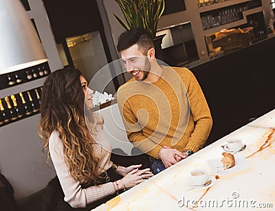 Couple at the bar drinking coffee Stock Photo