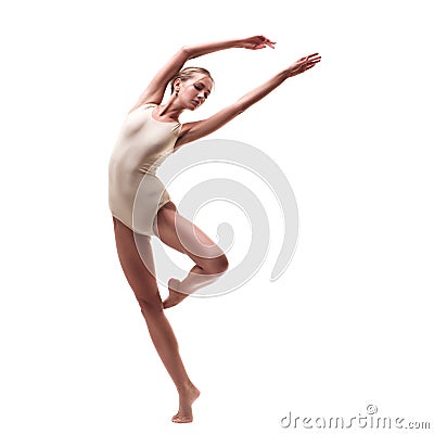 Young beautiful dancer in beige swimsuit Stock Photo