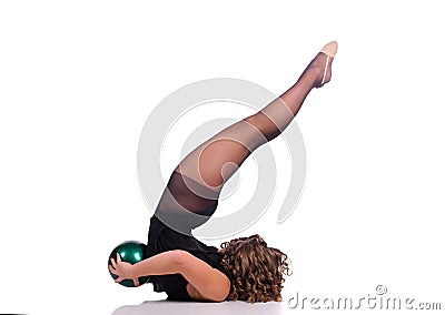 Young beautiful dancer gymnastics posing in studio Stock Photo