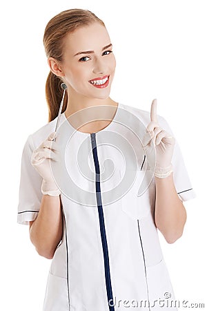 Young beautiful dentist woman with equipment. Stock Photo