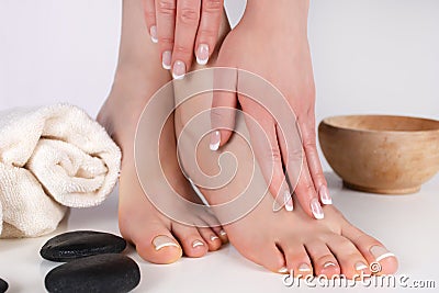 Embrace Beauty and Femininity: French Manicure and Pedicure in a Spa Studio Stock Photo
