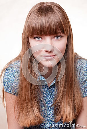 Young beautiful girl in blue blouse Stock Photo