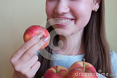 young beautiful girl eating an apple, close-up Stock Photo