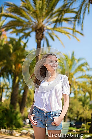 Young beautiful girl enjoying sunny day in Cannes Stock Photo