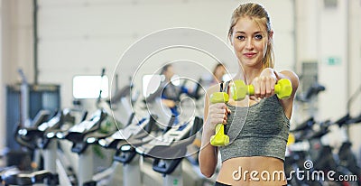 Young beautiful girl in the gym doing exercises on the squat with a barbell, improving the muscles of the buttocks and legs Concep Stock Photo